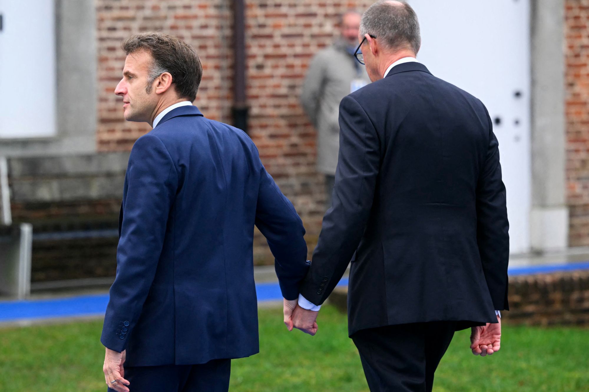 Macron e merz f afp